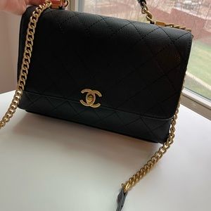 Black Chanel leather purse with strap